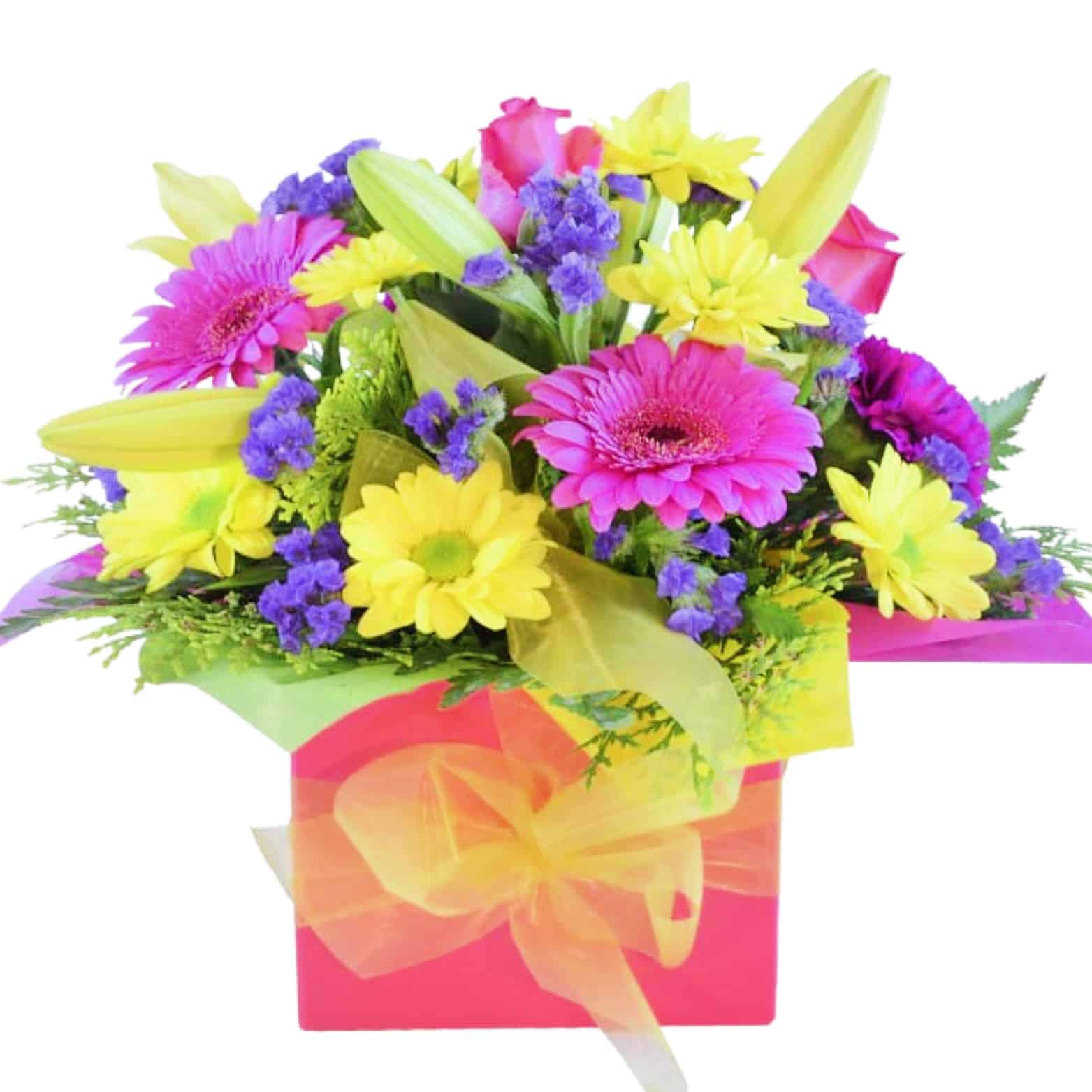 A colorful mini box of yellow, pink, and purple roses, mini gerberas, lilies, and chrysanthemums with greenery.