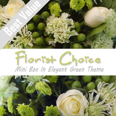 An elegant green mini box of fresh seasonal flowers, arranged with greenery for a serene touch.