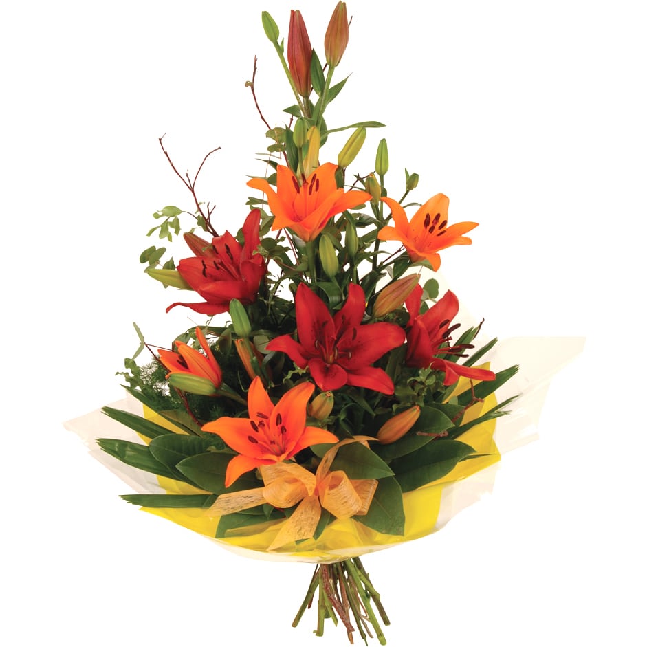 A bold orange, red, and green bouquet of lilies, palm, and magnolia leaves for a dramatic tropical look.