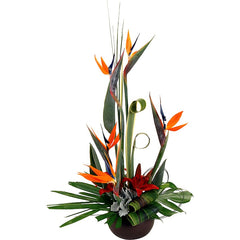 A modern ceramic container with orange and green strelitzia, lilium, palm leaves, and tropical foliage accents.