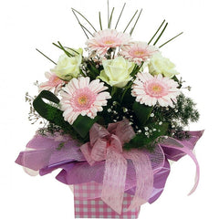 Special Thoughts: Pastel pink and cream mini box arrangement with mini gerberas and roses.