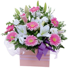 Berry Snowflake: Pink and white box arrangement with gerberas, oriental lilies, and lisianthus.