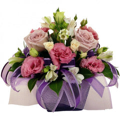 Crystabell Arrangement in Ceramic: Pale pink and cream ceramic arrangement with lisianthus, roses, and alstroemeria.