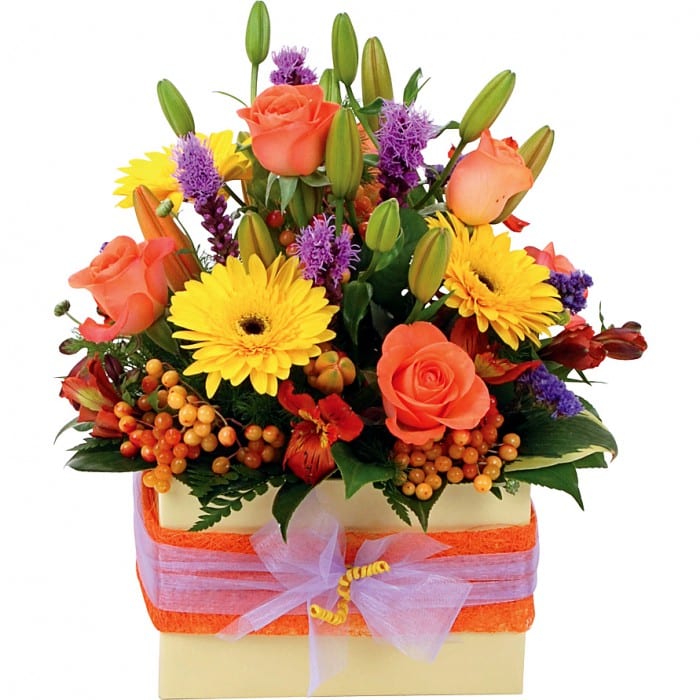 Sunrise Box: Orange, yellow, and purple box arrangement with roses, lilies, and berries.