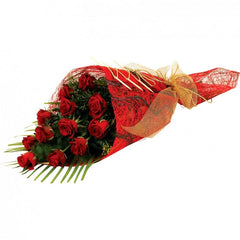 A sleek sheath bouquet of 12 long-stem red roses with greenery, exuding timeless romance.