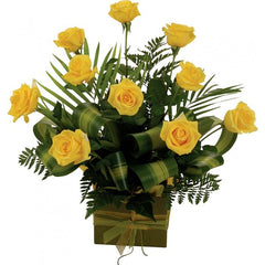 Yellow Roses Arrangement- 10 Roses: Box arrangement of 10 medium-stem yellow roses with tropical leaves.
