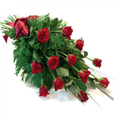 Whisper Of Wisdom Roses: Spray of 12 red roses with green foliage and spear grass.