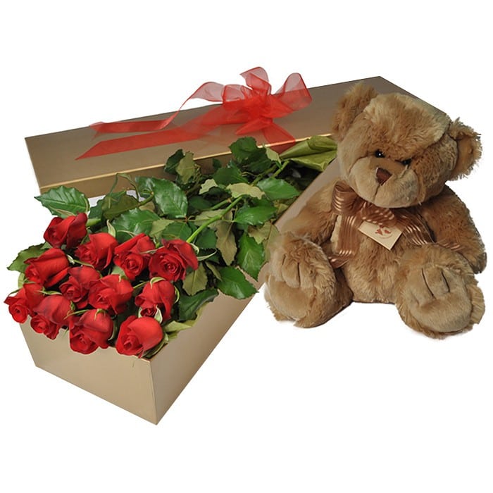 A Valentine’s gift box of 12 long-stem red roses with a soft toy teddy, elegantly arranged for romance.