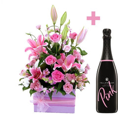 A pink and white box of roses, oriental lilies, alstroemeria, and lisianthus with a 750ml bottle of Pink by YellowGlen.