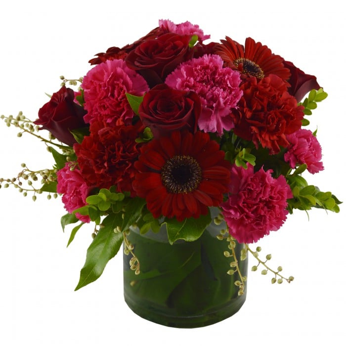 My True Love - Red Flowers in a Vase: Pink and red low vase arrangement with carnations and gerberas.