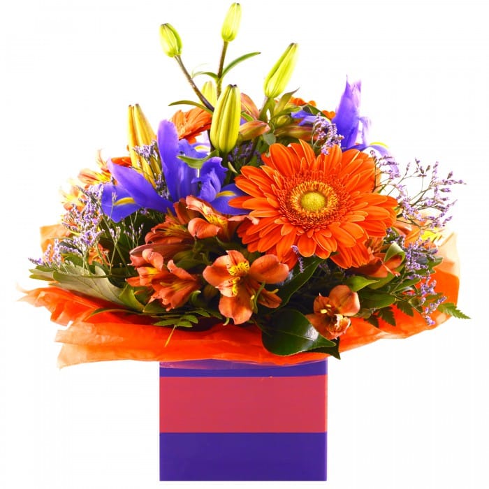 Design by Kacie: Orange and purple box arrangement with gerberas, iris, and asiatic lilies.