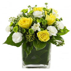 Lots Of Joy Yellow Flowers in Cube Vase: Yellow and white flowers in a glass cube vase.