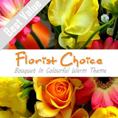 A warm bouquet of red, orange, and yellow seasonal flowers, accented with greenery for a cozy feel.
