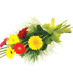A sleek sheath bouquet of red and yellow mini gerberas with greenery for a bright, cheerful look.