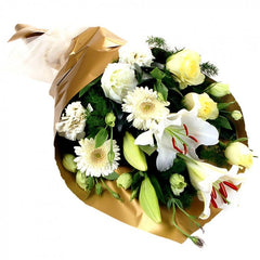 Diamond Rough: White bouquet with lilies, mini gerberas, roses, and lisianthus.