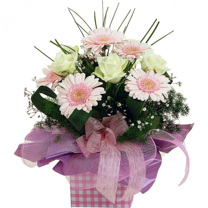 Special Thoughts: Pastel pink and cream mini box arrangement with mini gerberas and roses.