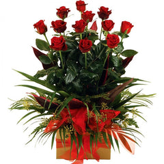 A sleek box of 12 long-stem roses with greenery, exuding timeless romance.