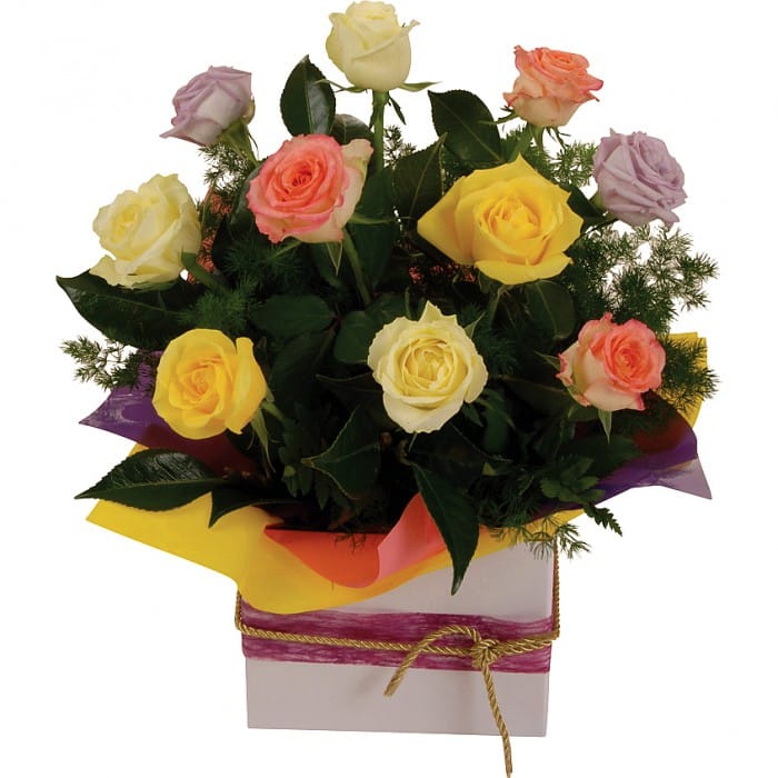 10 mixed Colour Roses - Abundance: Colorful box arrangement of 10 medium-stem roses in various hues with green foliage.