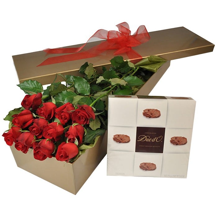 A romantic gift box of 12 long-stem red roses with a medium box of chocolates for a Valentine’s gesture.
