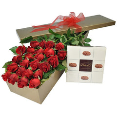 A vibrant gift box containing 24 long-stem red roses and a 250g box of chocolates, elegantly arranged for a romantic occasion.